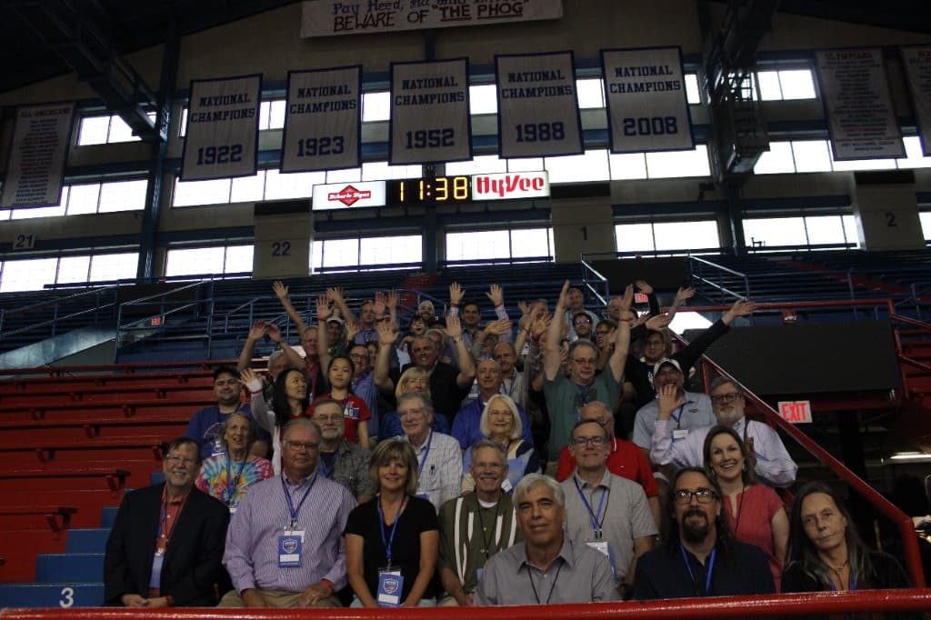 Run It Back alumni group photo at Allen Fieldhouse